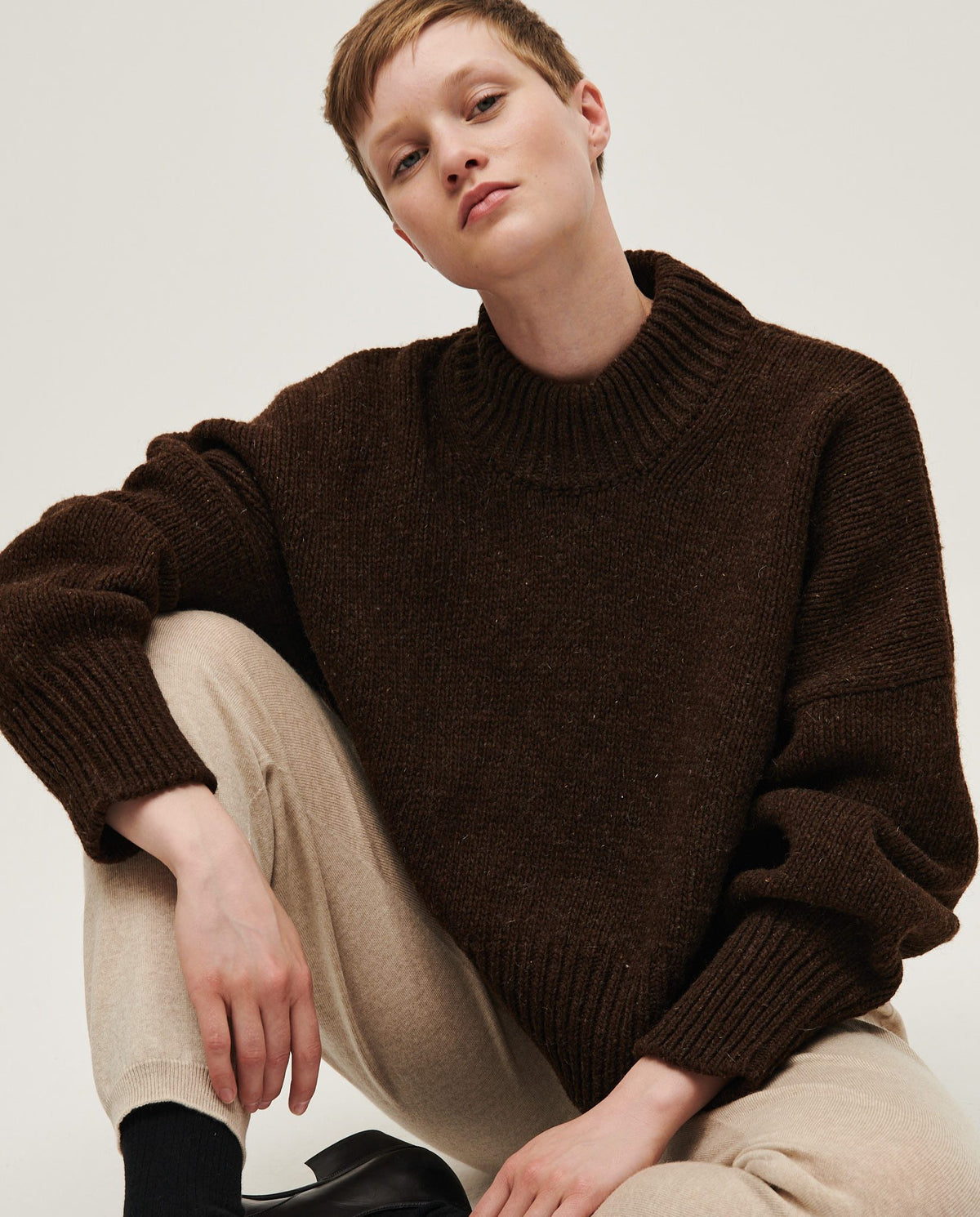 Babaà No15 Earth women's jumper featuring a cozy, earthy-toned knit fabric and relaxed fit, worn by a woman.