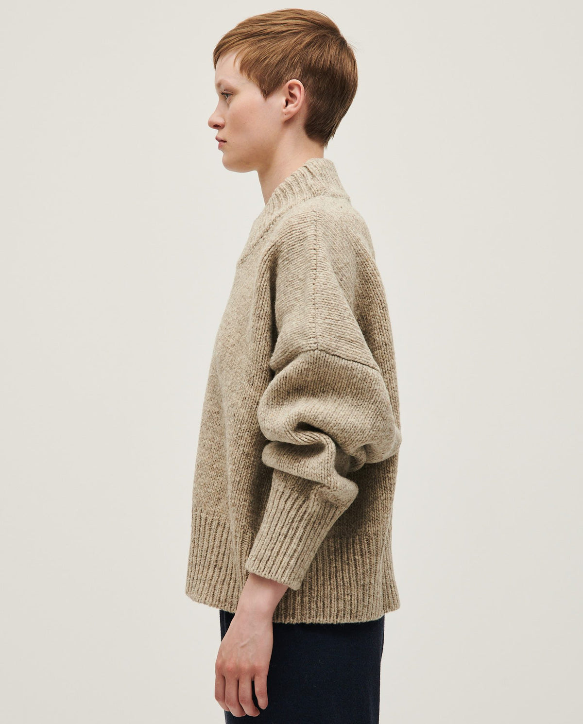 Woman wearing Babaà Jumper No15 Mist, cozy knit sweater in soft mist color, styled for casual comfort.