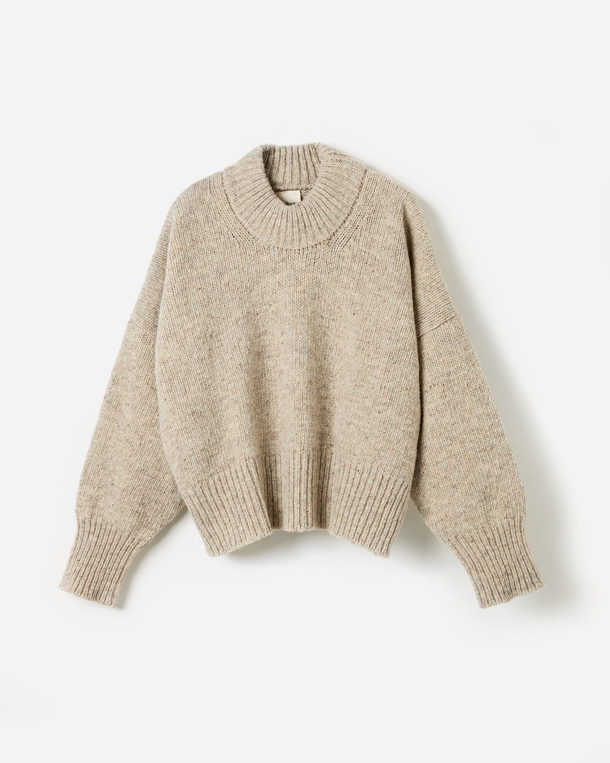 Silhouette of a woman wearing Babaà Jumper No15 Mist, showcasing a cozy, stylish knit sweater on a neutral background.