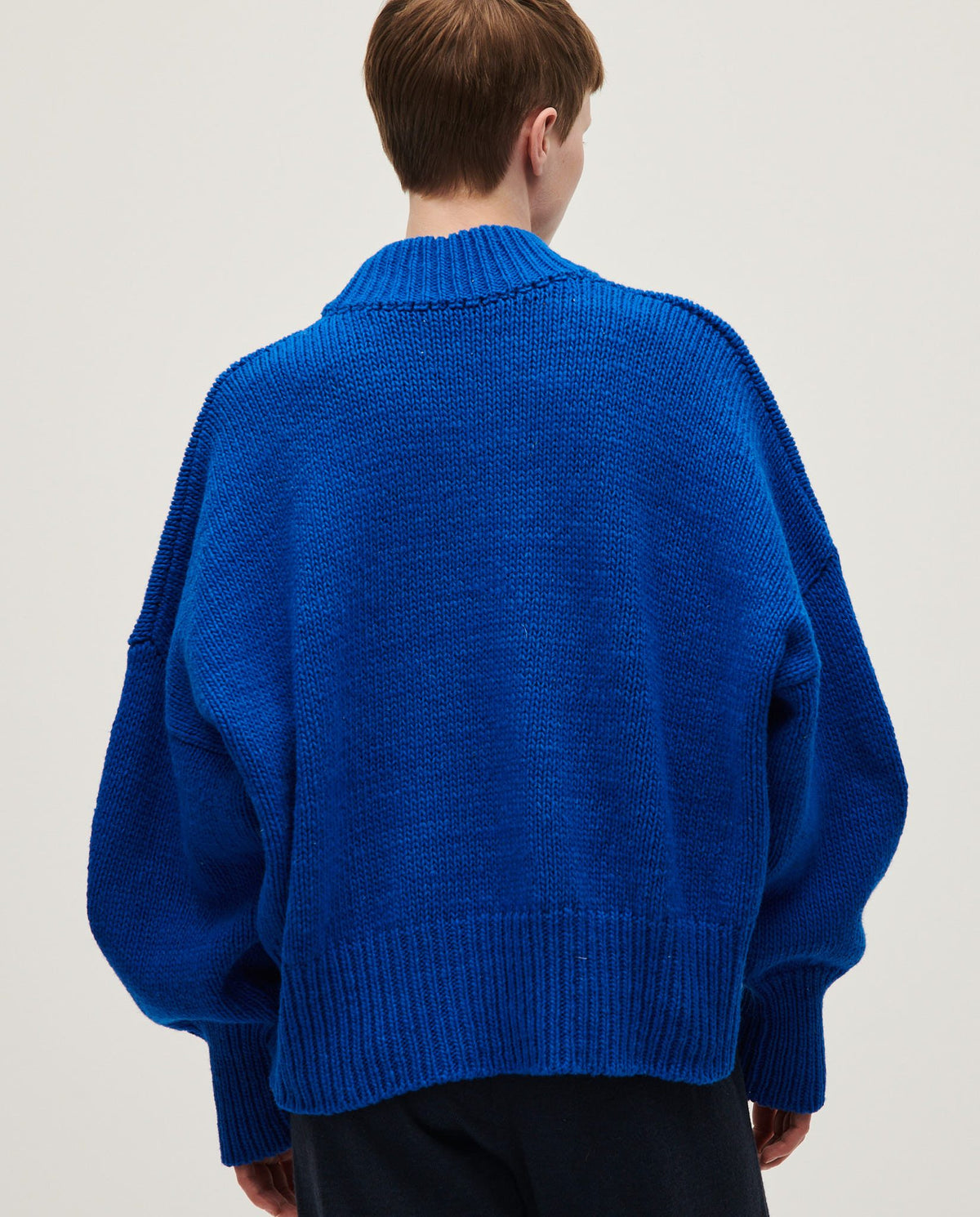 Woman wearing Babaà No15 Winterskies jumper, cozy knitted sweater with a relaxed fit and winter-inspired design.
