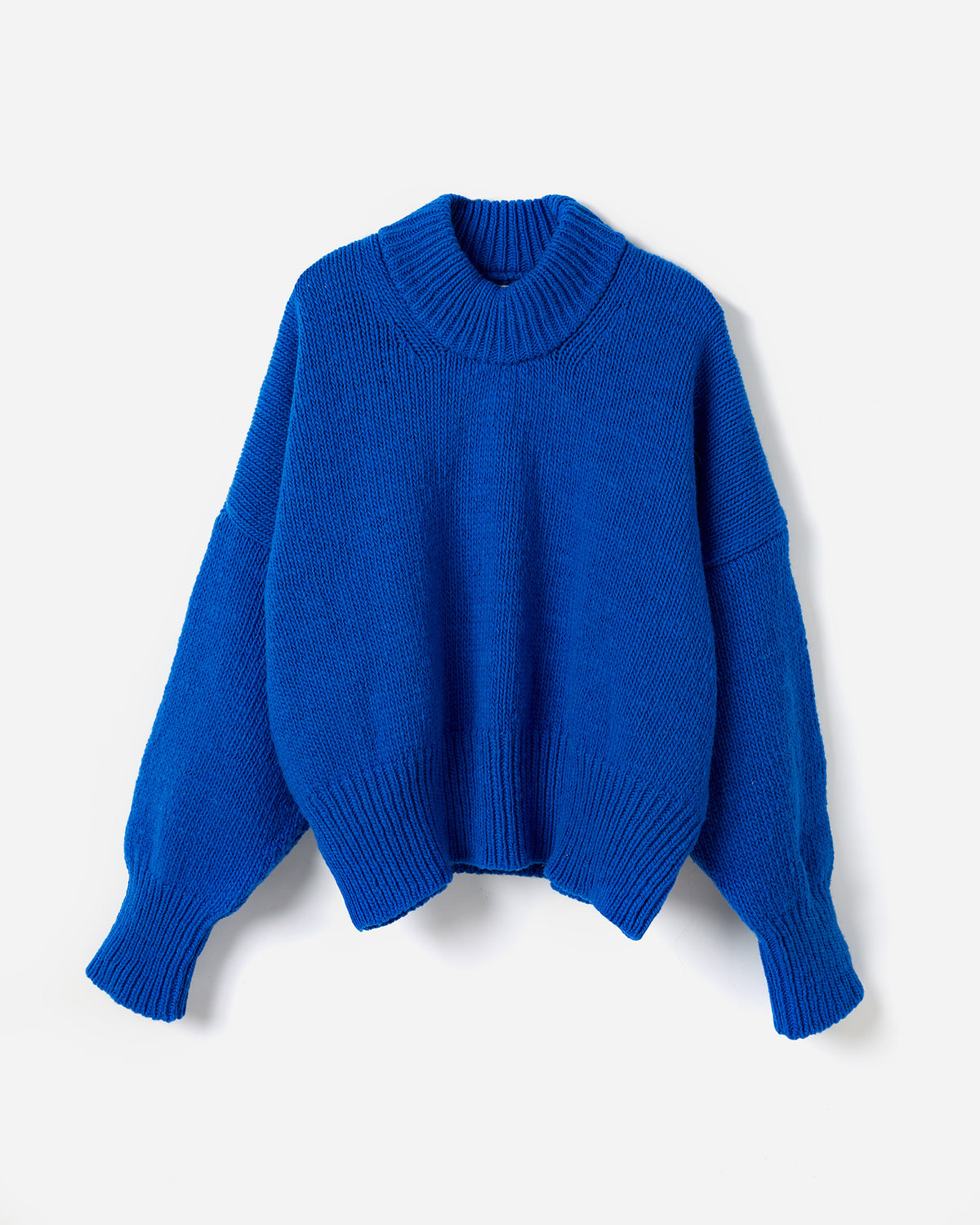 Silhouette of a woman wearing Babaà No15 Winterskies jumper, showcasing the cozy, stylish winter knit in natural light.
