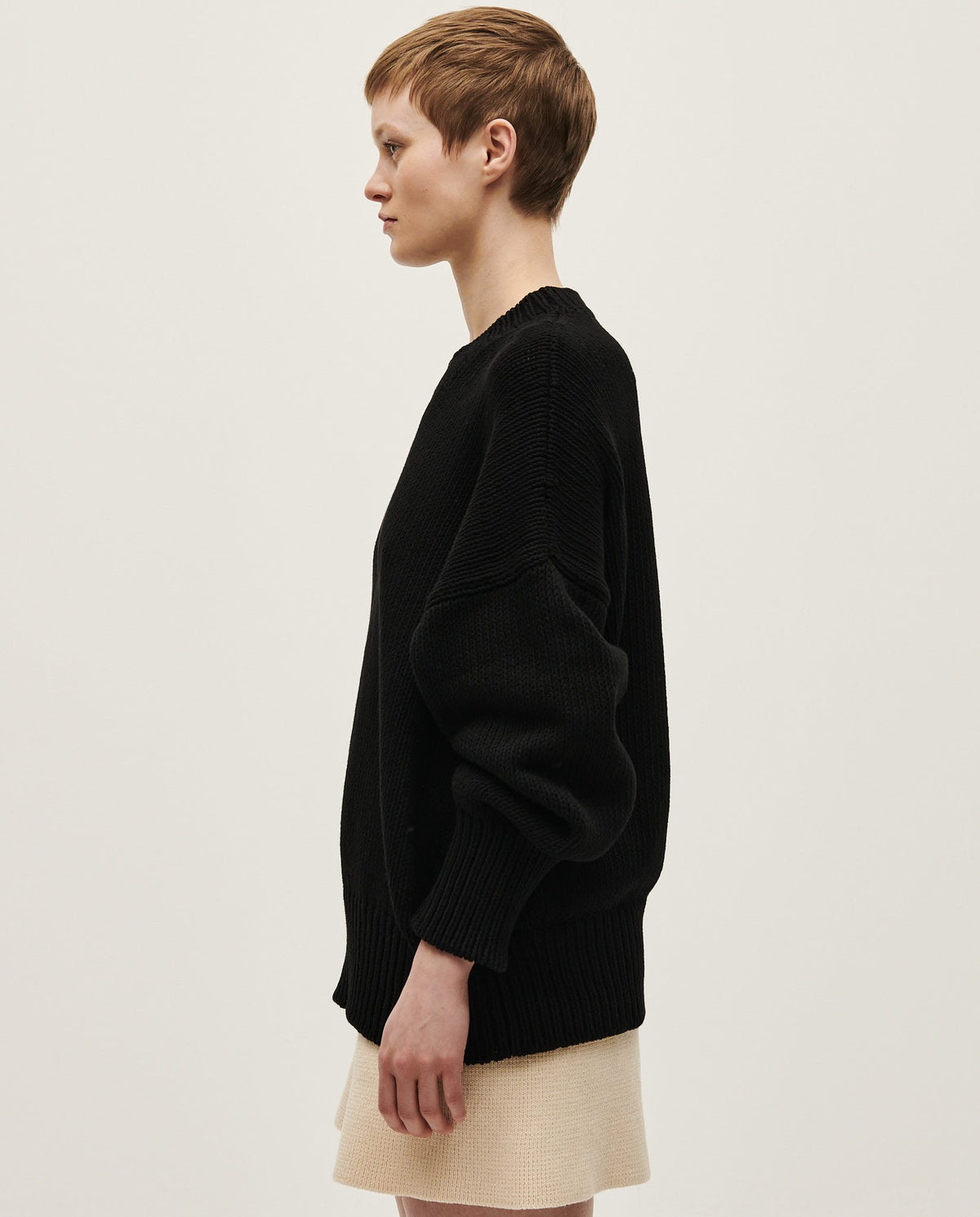 Black Babaà No16 jumper worn by a woman, featuring a cozy, stylish design with a relaxed fit and soft fabric.