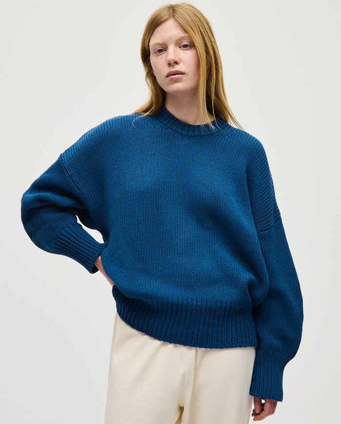 Babaà Jumper No16 Deep Water worn by a woman, featuring a cozy knit design in deep water blue.