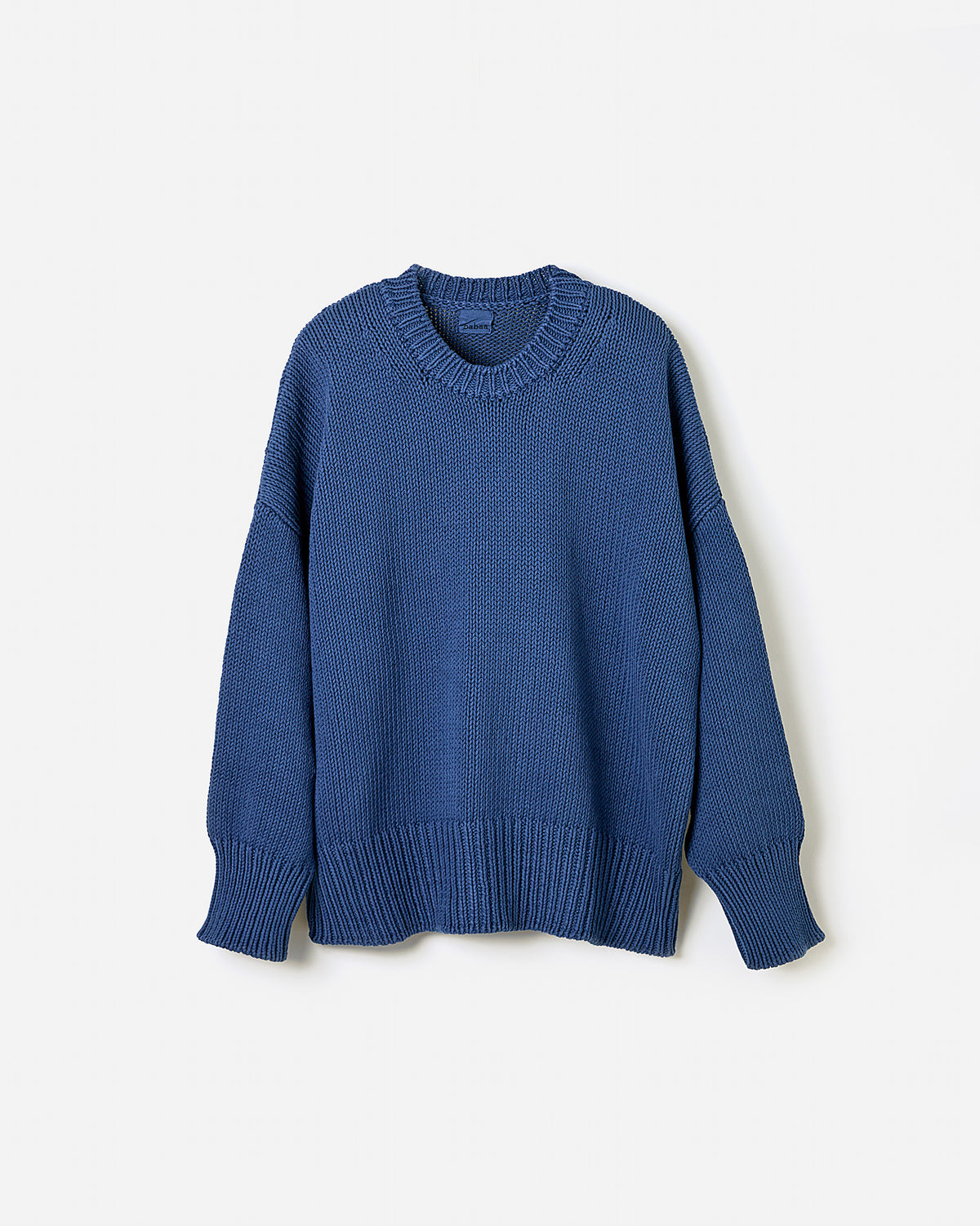 Silhouette of a woman wearing Babaà Jumper No16 Deep Water, showcasing its relaxed fit and deep water blue color.