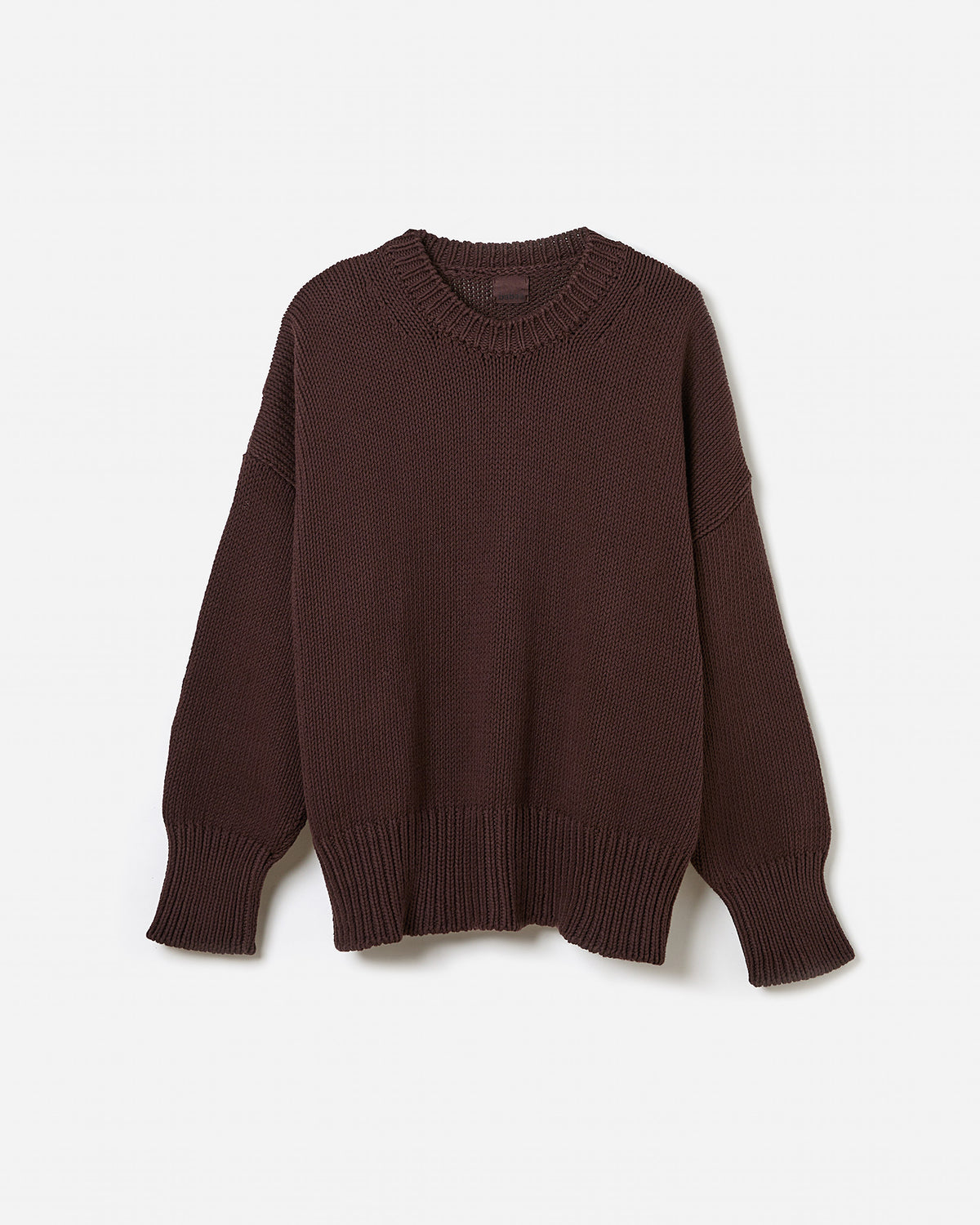 Silhouette of a woman wearing Babaà Jumper No16 Husk, showcasing the relaxed fit and cozy knit design.