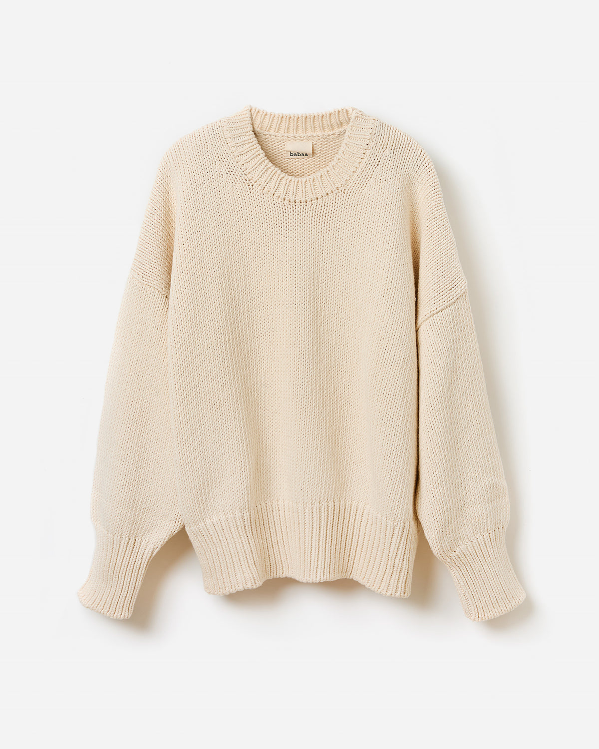 Woman wearing Babaà No16 Natural jumper, showing the relaxed fit and soft fabric in a stylish silhouette.