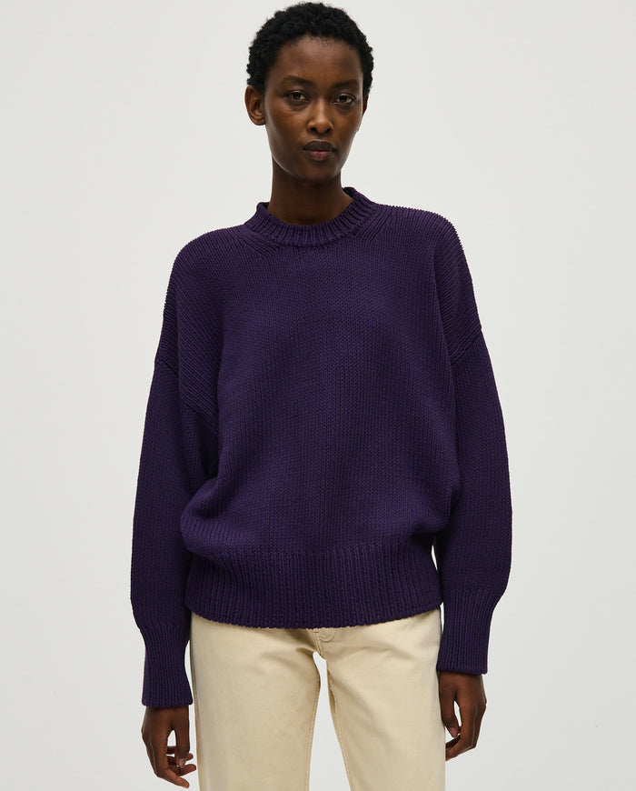 Woman wearing Babaà No16 Ridge jumper, featuring a cozy, textured knit design in a stylish, relaxed fit.