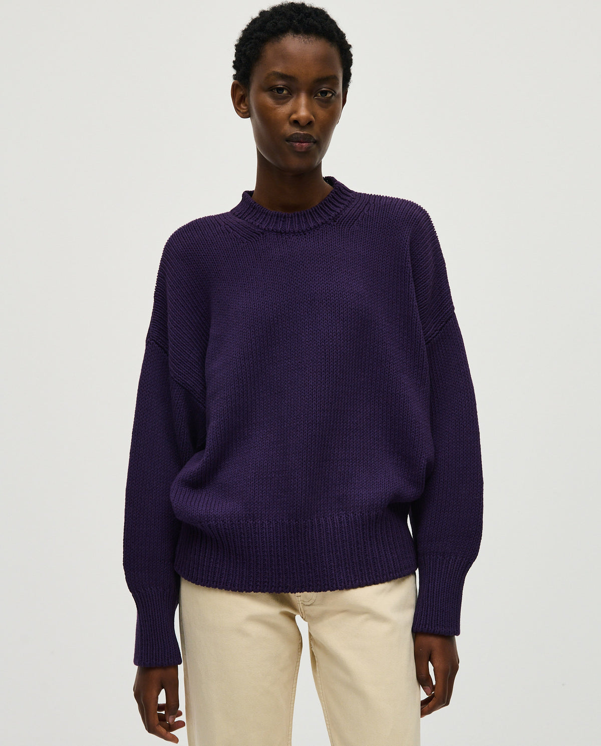 Woman wearing Babaà No16 Ridge jumper, featuring a cozy, textured knit design in a stylish, relaxed fit.