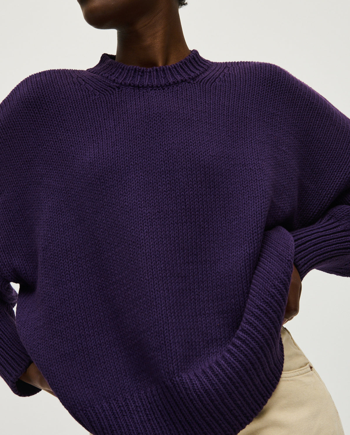 Woman wearing Babaà No16 Ridge jumper, featuring a cozy, textured knit design in a stylish, relaxed fit.