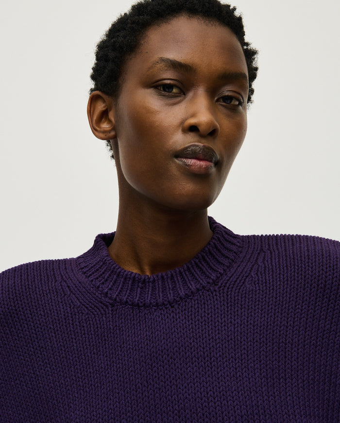 Woman wearing Babaà No16 Ridge jumper, featuring a cozy, textured knit in a relaxed fit, ideal for casual wear.