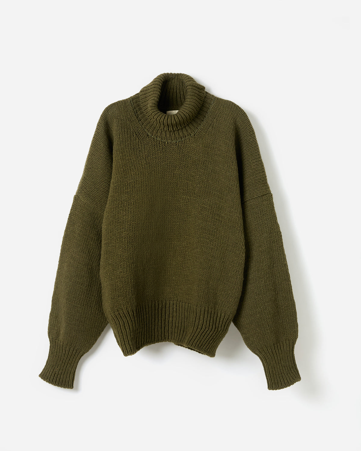 Silhouette of a woman wearing Babaà No17 Alga jumper, showcasing the relaxed fit and lightweight fabric.