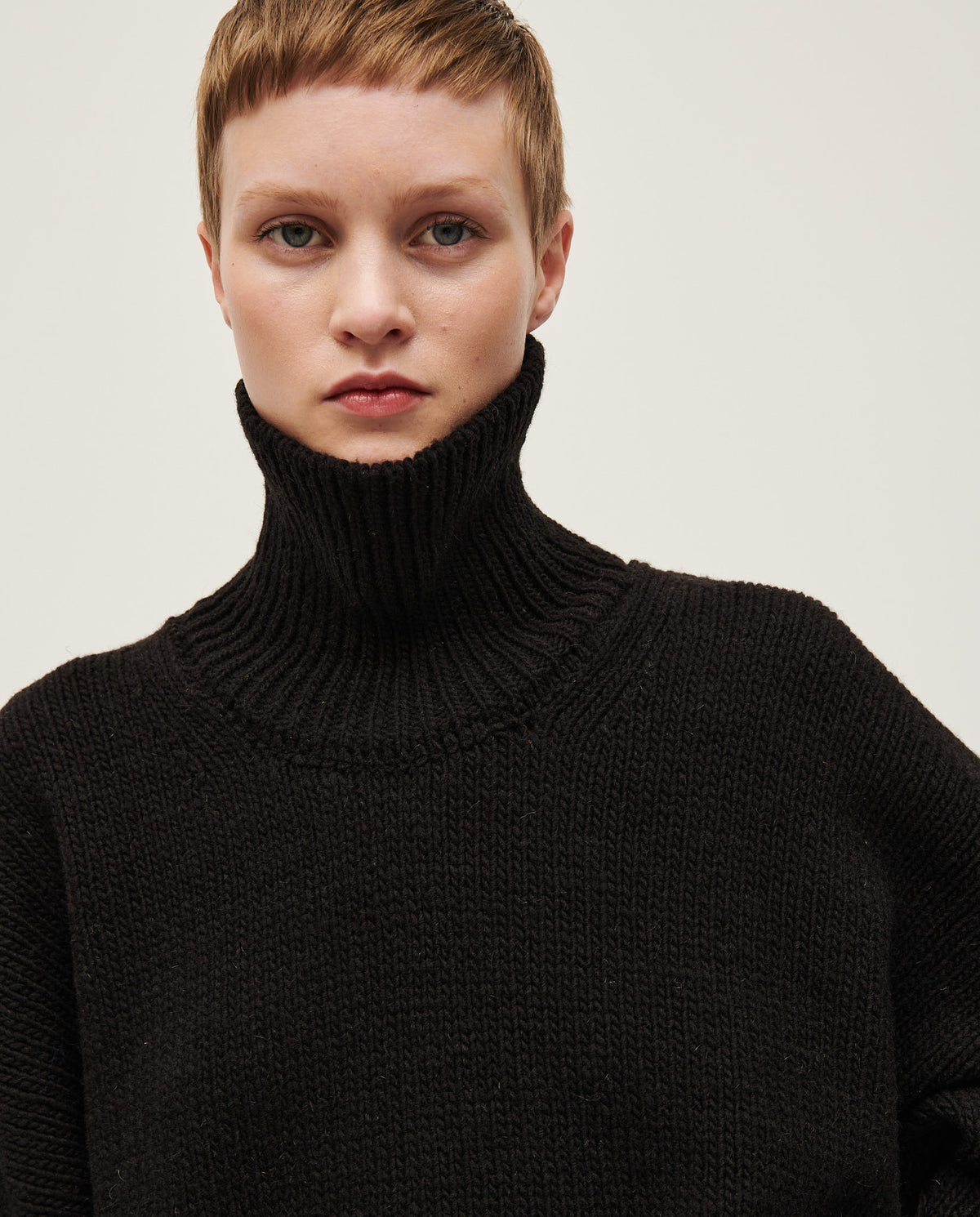 Black Babaà No17 women's jumper displayed on a model, showcasing its cozy fit and stylish design.