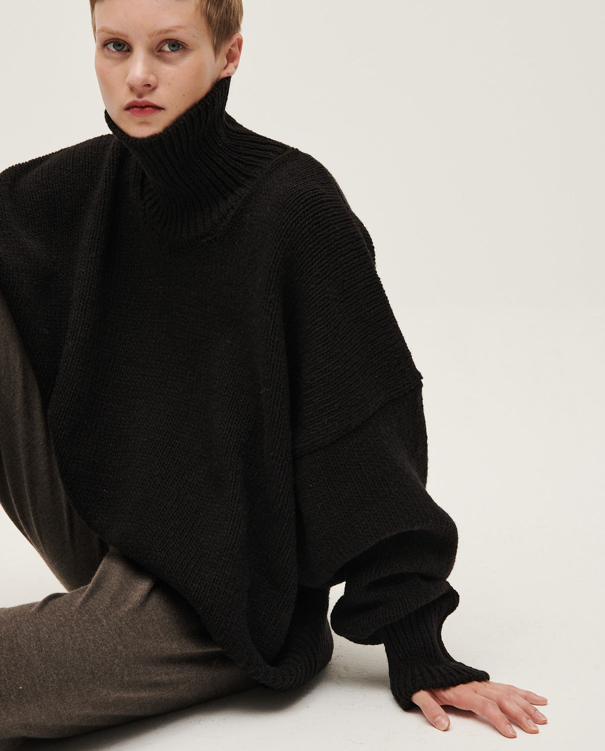 Black Babaà No17 women's jumper, soft knit fabric, featuring a relaxed fit and ribbed cuffs, styled on a model.