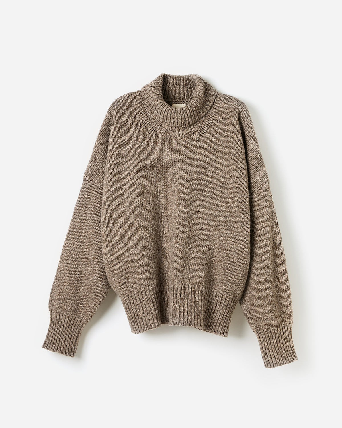 Woman wearing Babaà No17 Dark Mist jumper, showcasing the relaxed fit and soft fabric in a stylish silhouette.