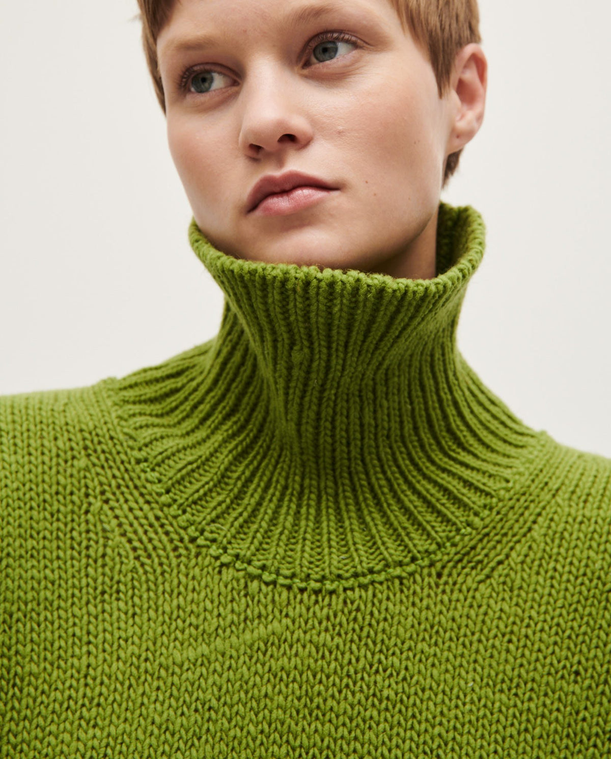 Woman wearing Babaà No17 Olivera jumper, showcasing a stylish knit sweater with a relaxed fit and textured fabric.