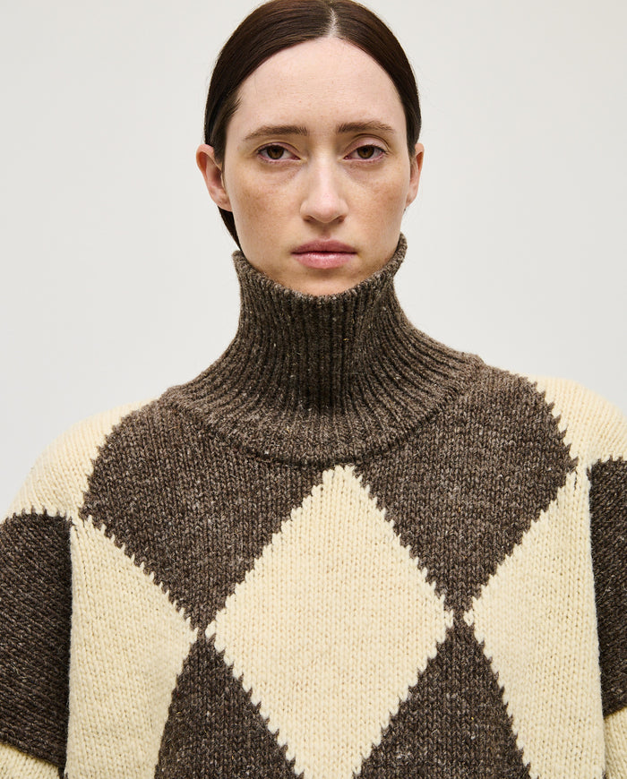 Woman wearing Babaà No17 Siesta jumper, soft knit in a relaxed fit, showcasing the stylish and comfortable sweater.