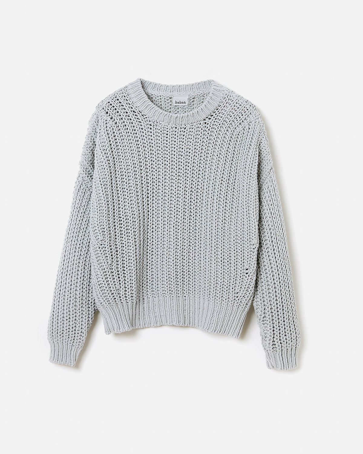 Silhouette of a woman wearing Babaà Jumper No18 Chalk, showcasing a cozy, stylish knit sweater in a relaxed fit.