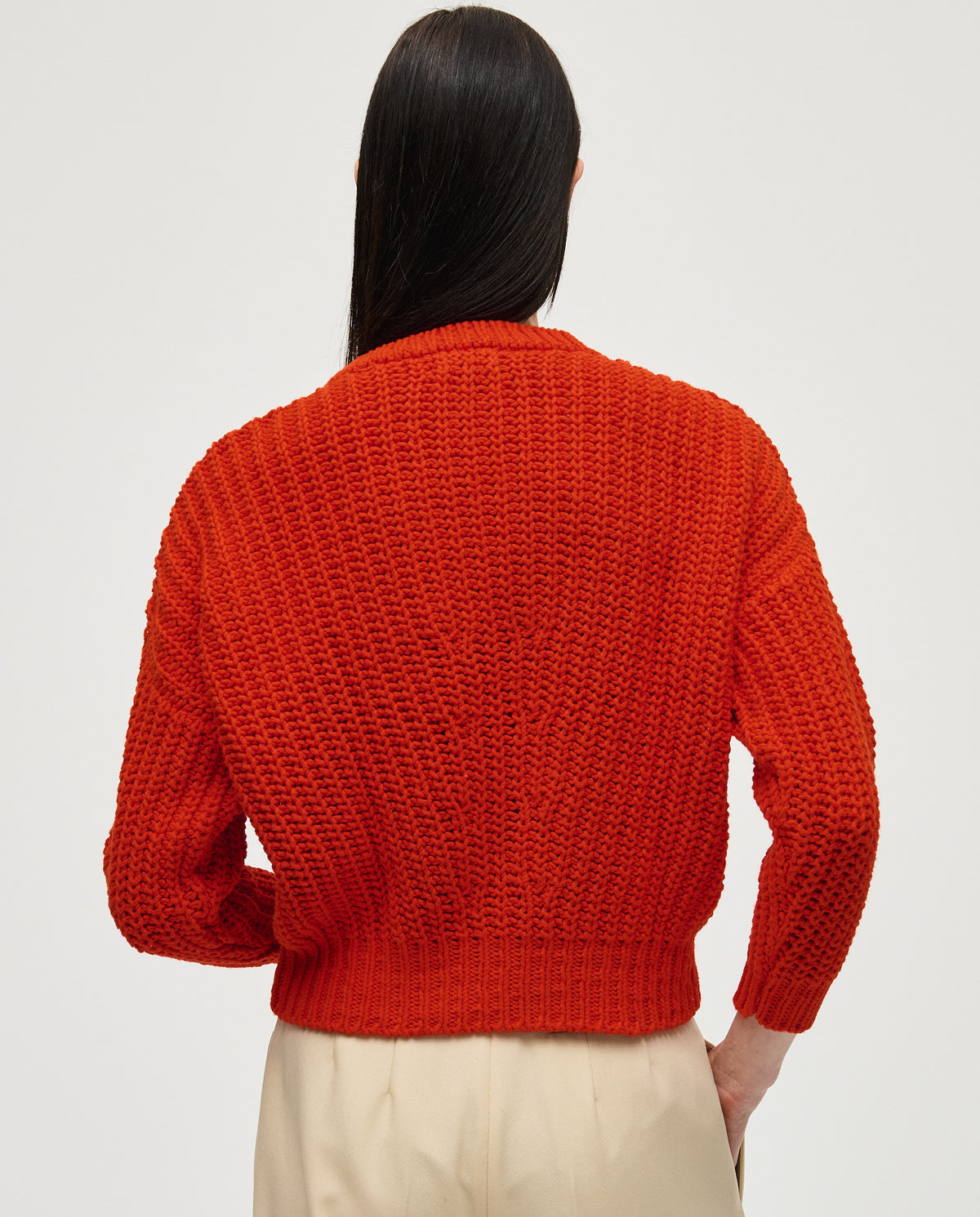 Babaà Jumper No18 Summer Flame worn by a woman, featuring a vibrant flame pattern and cozy knit fabric.