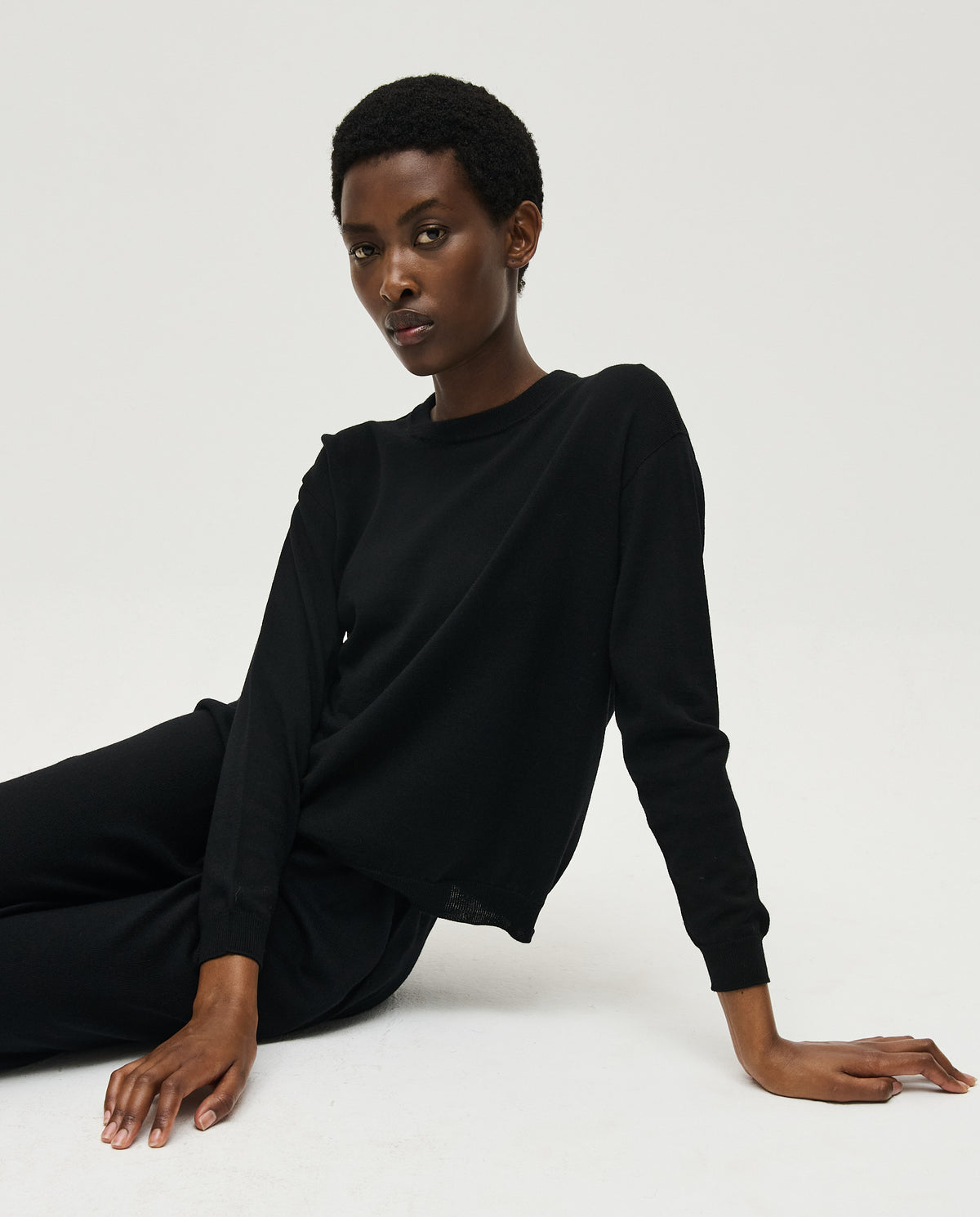 Black Babaà No25 women's jumper displayed on a woman, featuring a cozy, stylish knit design perfect for casual wear.