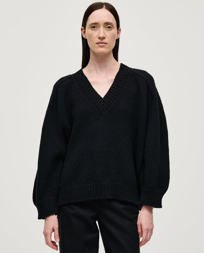 Black Babaà No29 women's jumper displayed on a woman, featuring a cozy, stylish knit design perfect for casual wear.