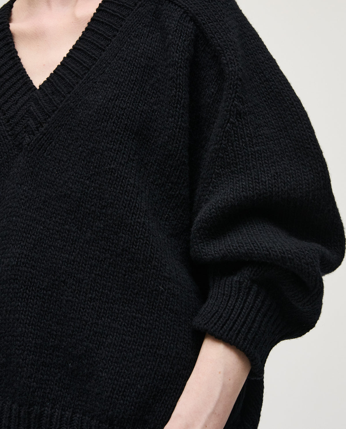 Black Babaà No29 jumper worn by a woman, featuring a cozy fit and stylish design, suitable for casual or chic outfits.