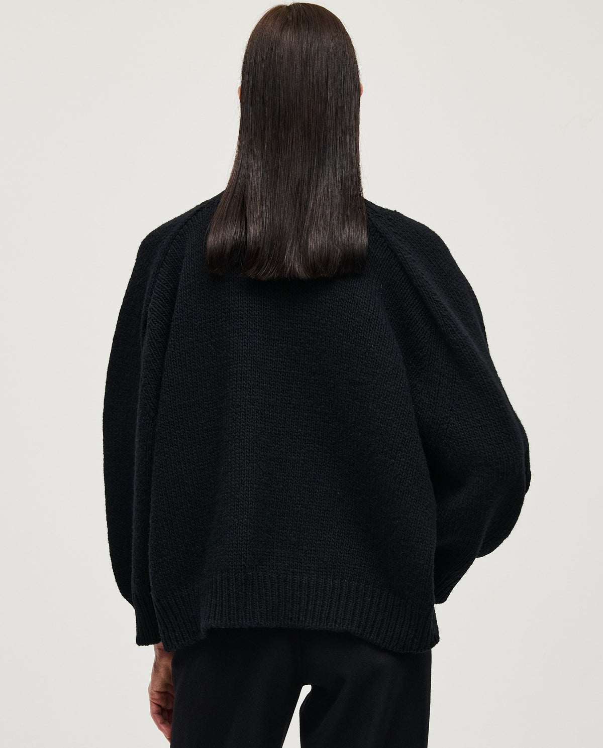 Black Babaà No29 women's jumper, soft knit fabric, featuring a relaxed fit and long sleeves, styled on a model.
