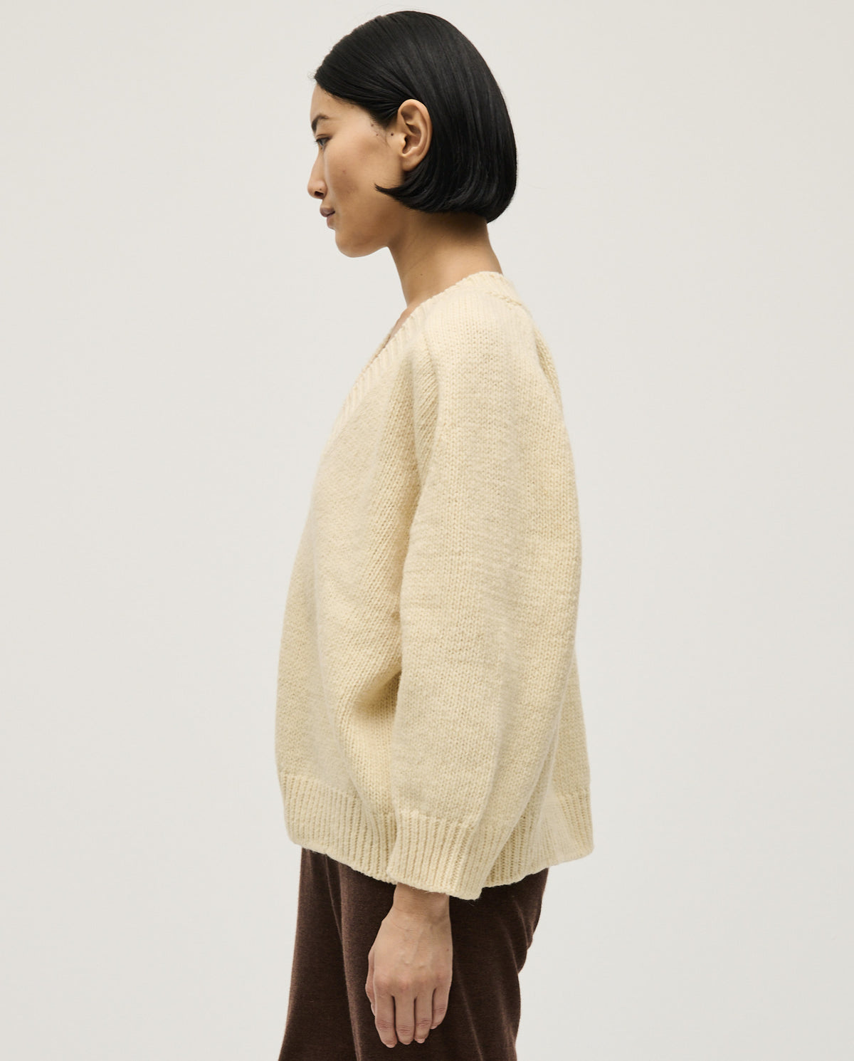Woman wearing Babaà No29 Natural jumper, stylish and cozy knit sweater, featuring a relaxed fit and neutral natural tone.