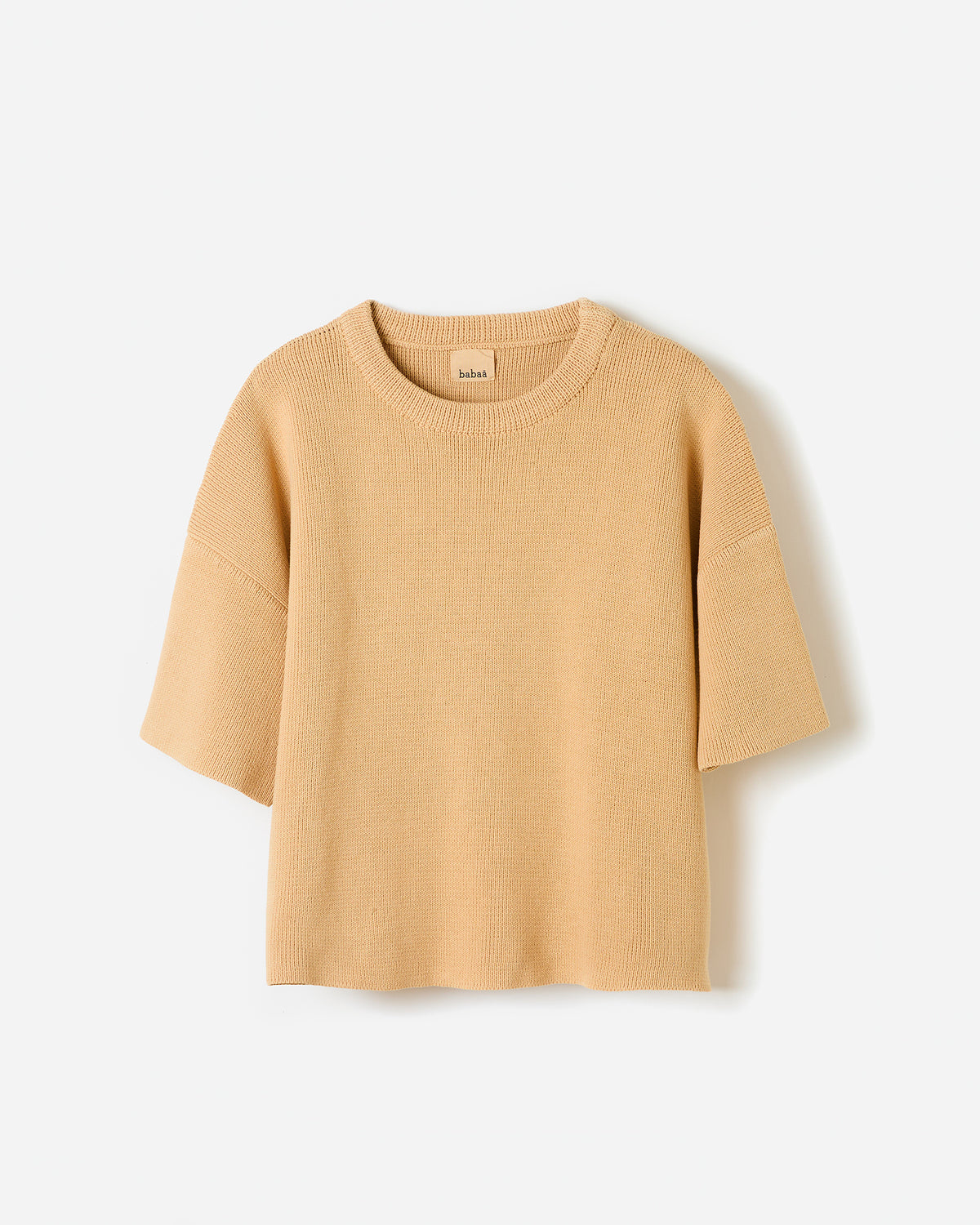 Silhouette of a woman wearing Babaà No35 clay pot jumper, showcasing the stylish and cozy knit sweater.