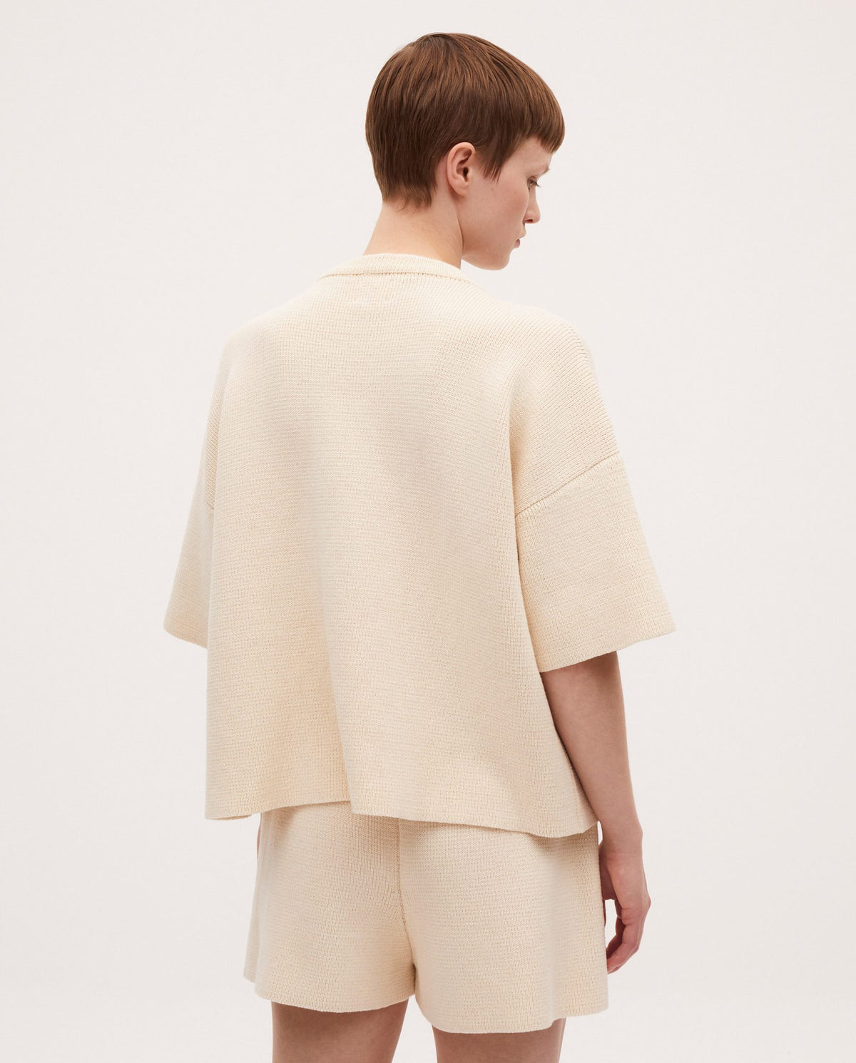 Woman wearing Babaà No35 Natural jumper, showcasing the soft, cozy knit in a neutral tone.