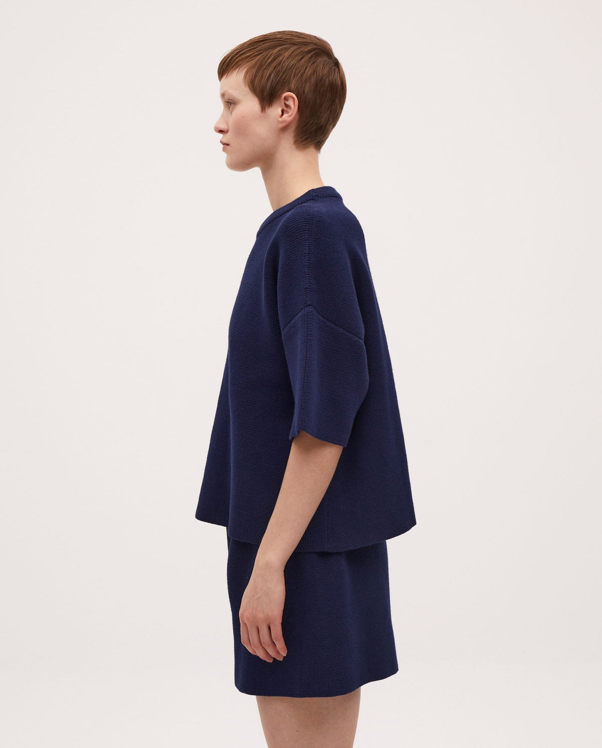 Navy jumper No35 by Babaà, worn by a woman, featuring a cozy knit fabric and relaxed fit, suitable for casual wear.