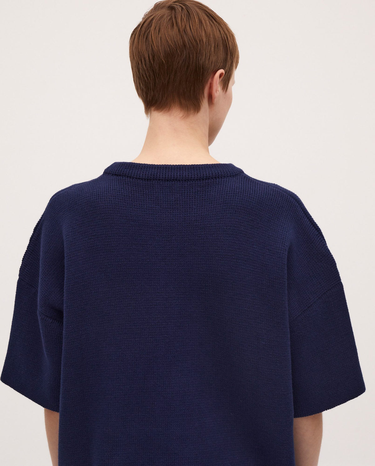 Navy jumper No35 by Babaà, worn by a woman, featuring a cozy knit fabric and stylish fit.