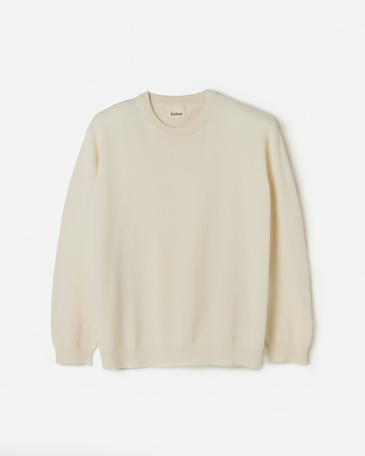 Woman wearing Babaà No41 Natural jumper, showcasing its relaxed fit and soft fabric in a casual silhouette.