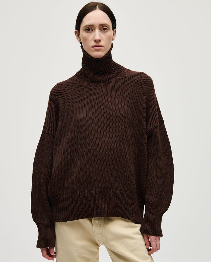 Woman wearing Babaà Jumper No42 Husk, featuring a cozy knit design and relaxed fit, showcasing stylish casual winter wear.