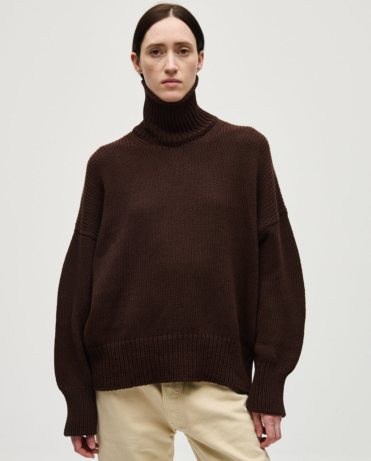 Woman wearing Babaà Jumper No42 Husk, featuring a cozy knit design and relaxed fit, showcasing stylish casual winter wear.