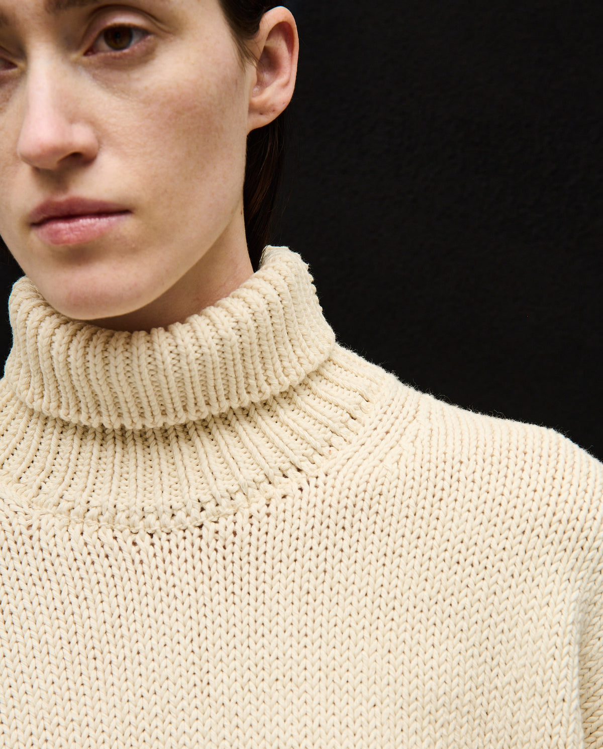 Woman wearing Babaà No42 natural jumper, knit sweater with a cozy, relaxed fit in soft, natural tones.
