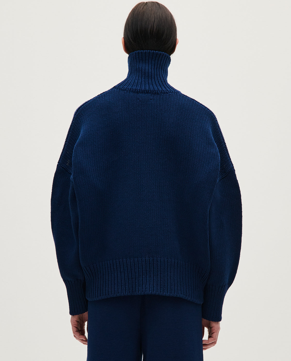Navy jumper No42 by Babaà, featuring a cozy knit design worn by a woman, perfect for casual fall or winter wear.