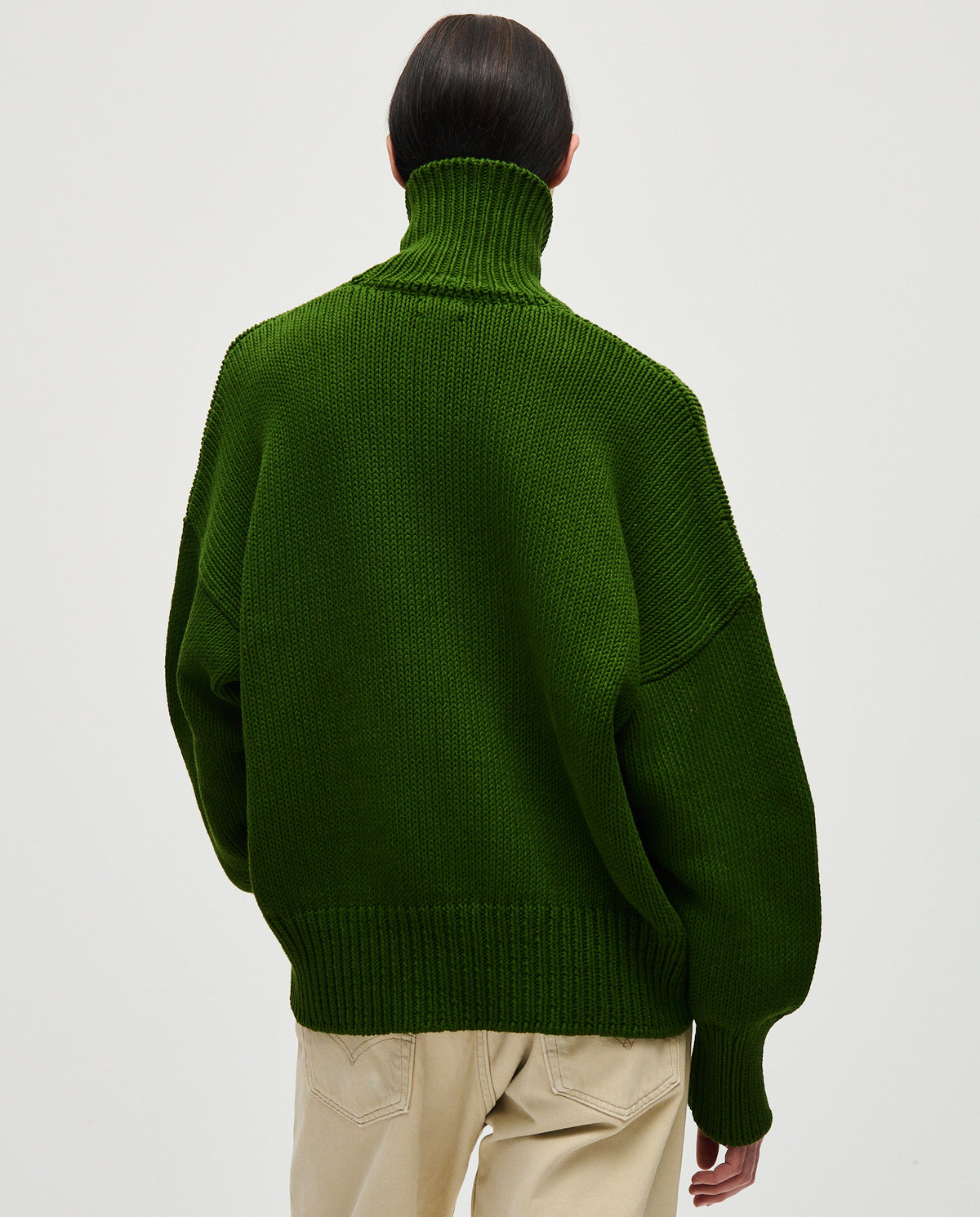 Babaà No42 pine jumper worn by woman, featuring a cozy knit design in a rich pine green color.