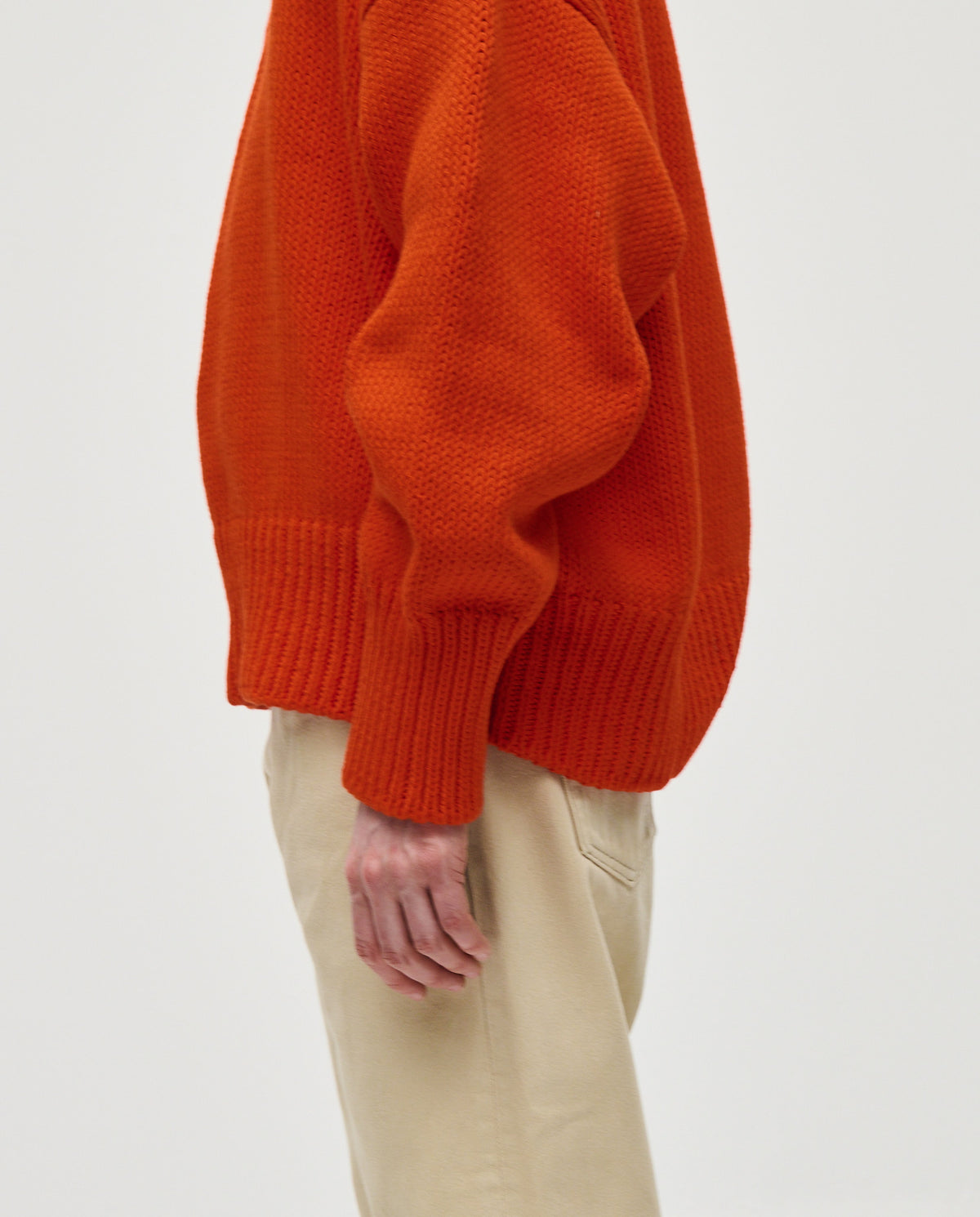 Woman wearing Babaà No42 Summer Flame jumper, featuring a stylish knit design in vibrant flame colors.