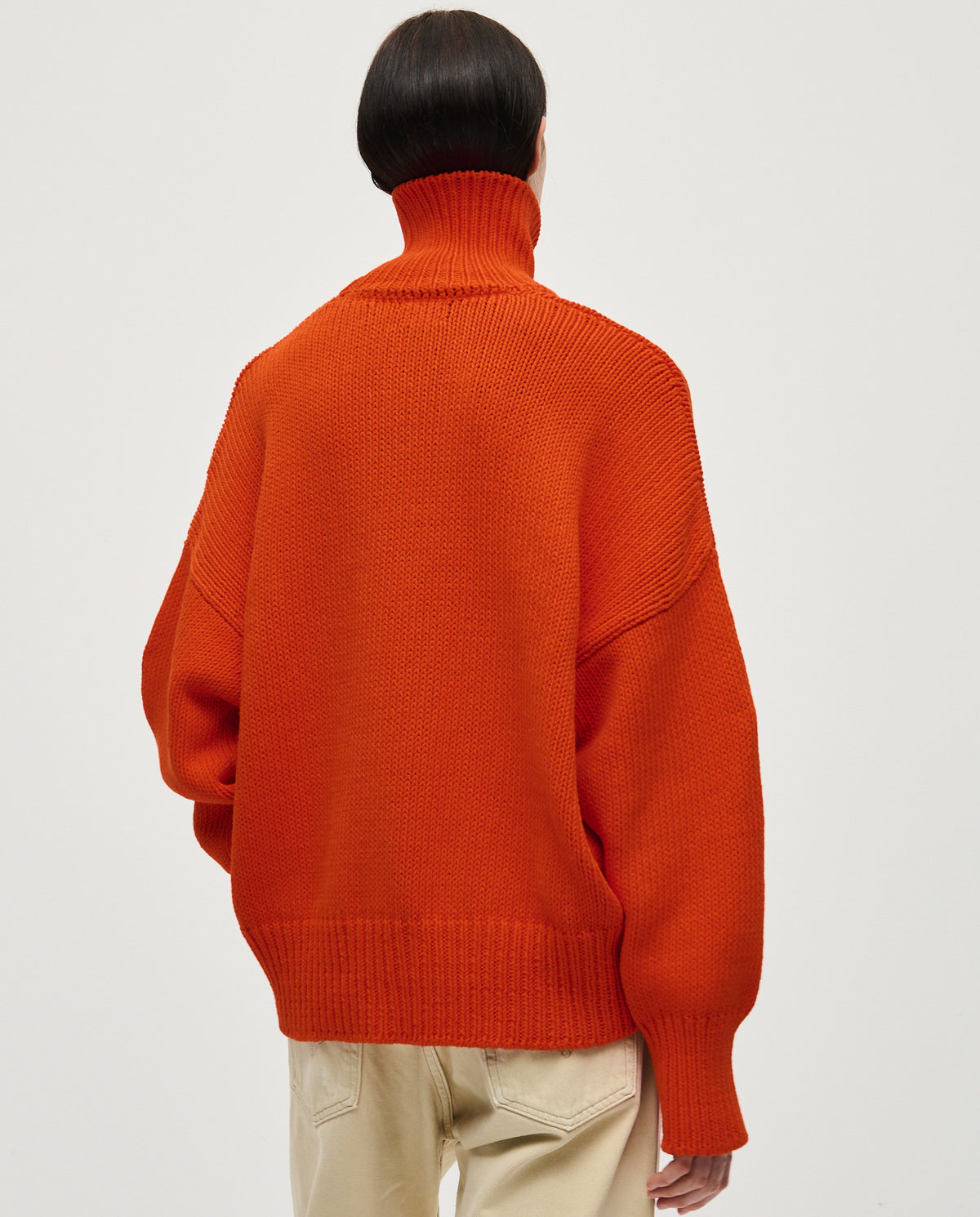 Babaà No42 summer flame women's jumper hanging on a rack with vibrant flame pattern and lightweight knit fabric.