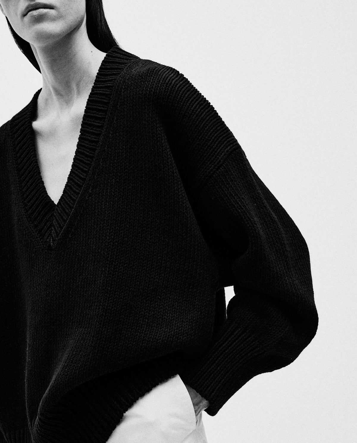 Black Babaà jumper no44 worn by a woman, featuring a cozy knit texture and relaxed fit for stylish comfort.