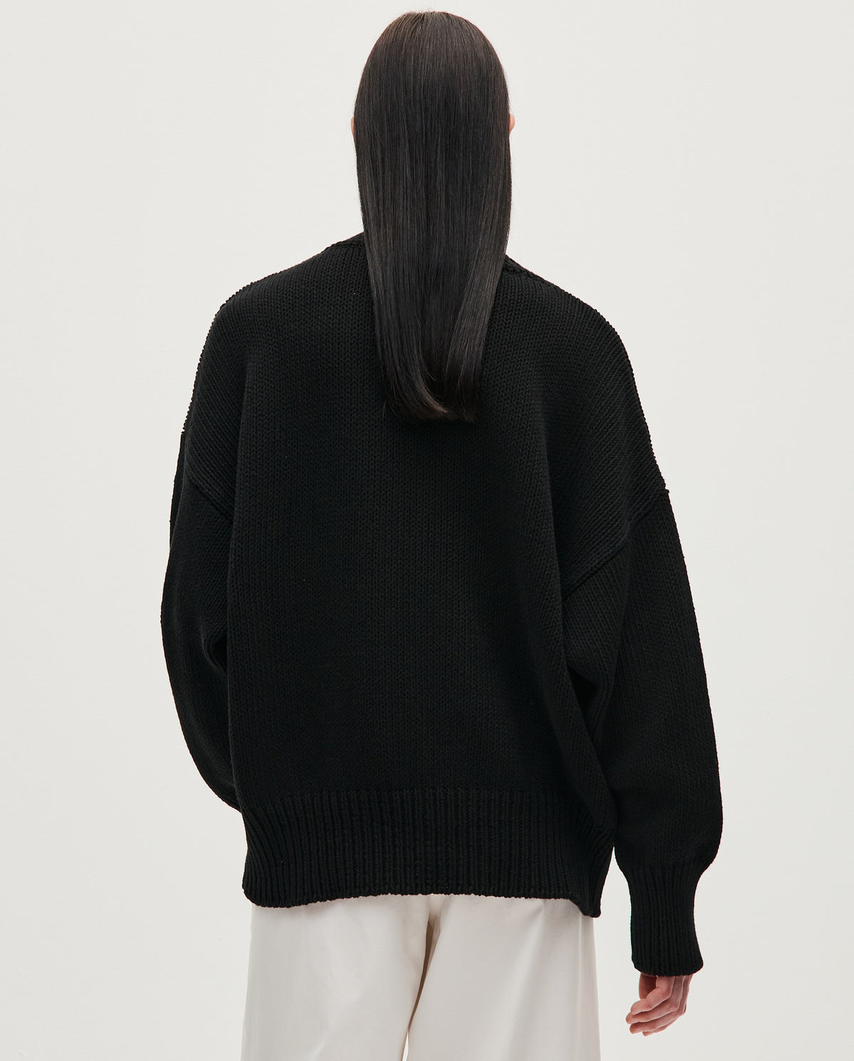 Black Babaà jumper No44 worn by a woman, featuring a cozy, stylish knit design perfect for casual or layered looks.