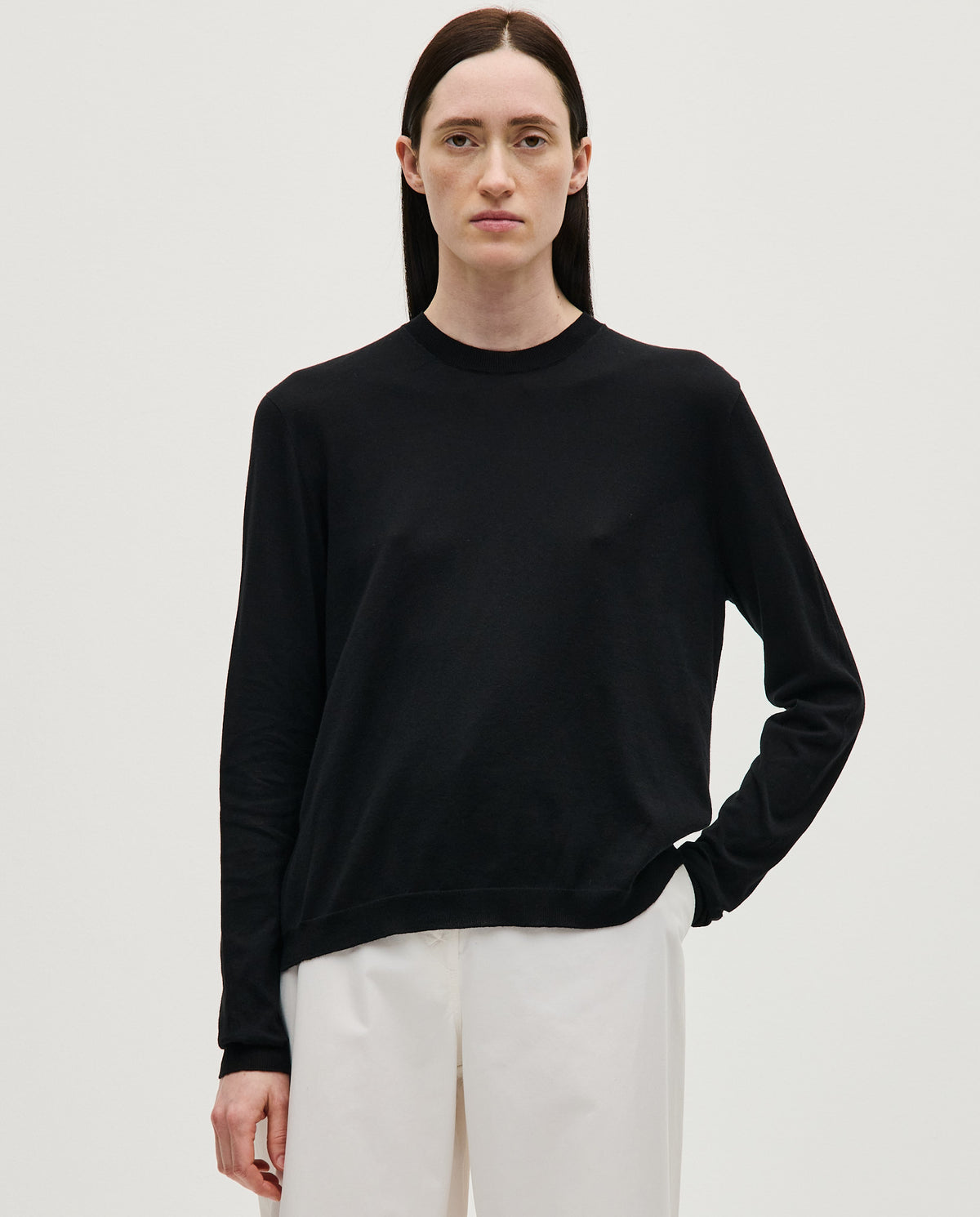 Black Babaà No50 women's jumper displayed on a woman, showcasing a stylish, cozy knit sweater with a relaxed fit.