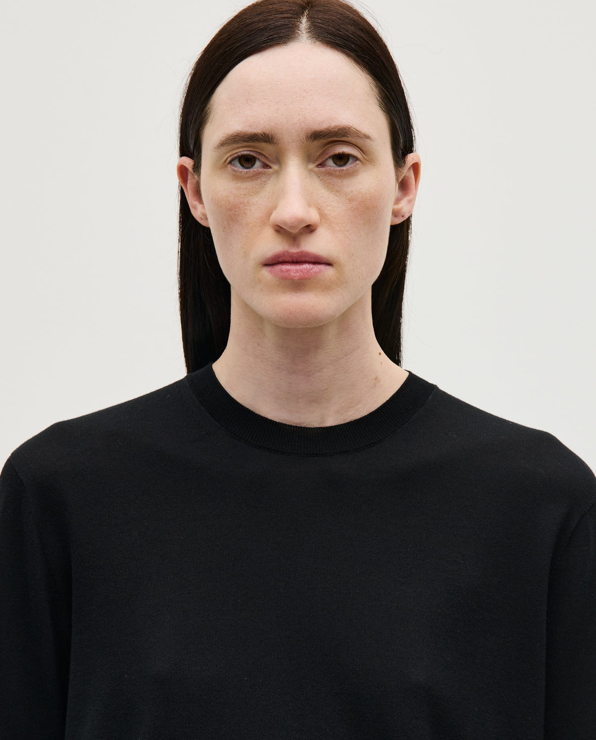 Black Babaà No50 women's jumper displayed on a woman, showcasing a stylish, cozy knit sweater in a casual fashion pose.