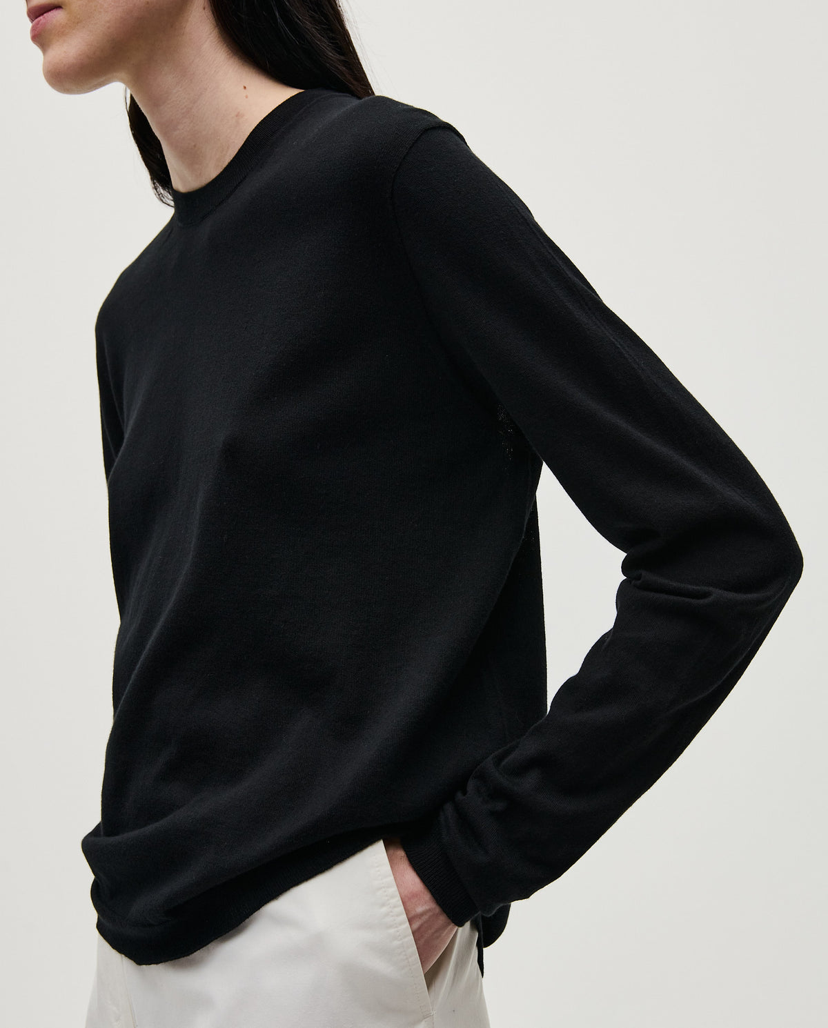Black Babaà No50 jumper worn by a woman, showcasing a cozy, stylish knit sweater with a relaxed fit.