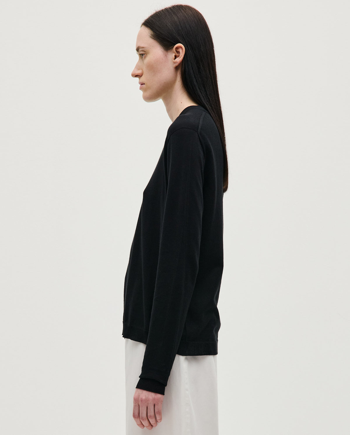 Black Babaà No50 jumper worn by a woman, showcasing a stylish, comfortable knit sweater with a relaxed fit.