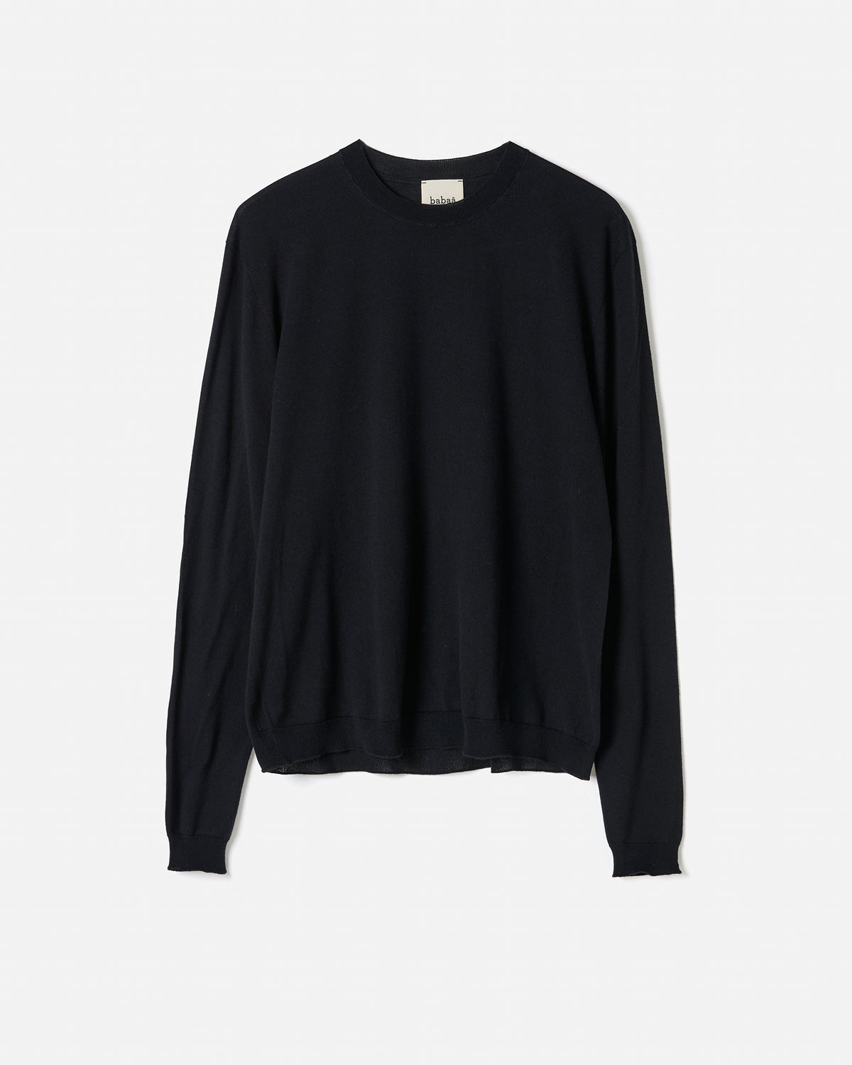 Black Babaà No50 jumper worn by a woman, showcasing a stylish, cozy knit sweater with a relaxed fit.