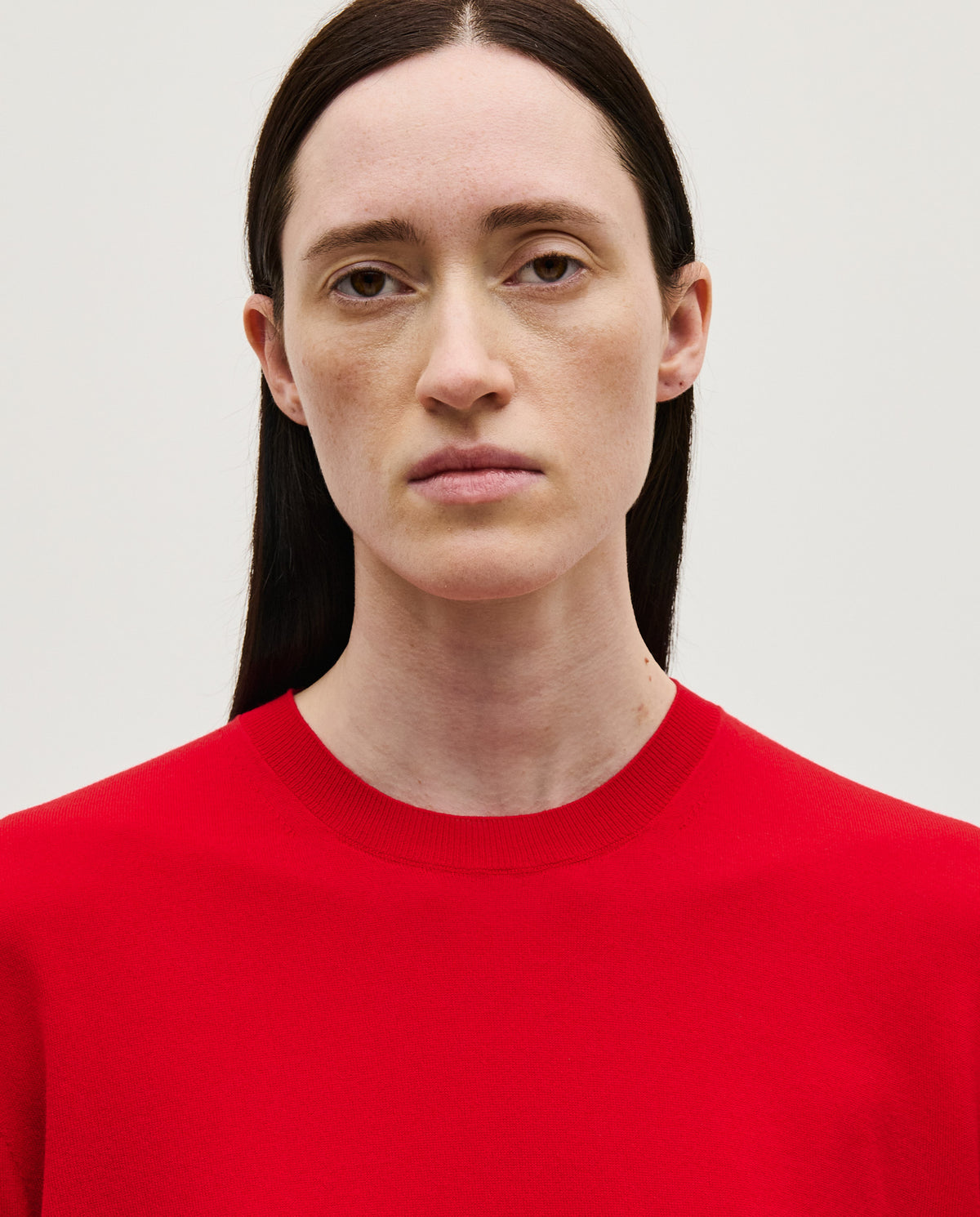 Red Babaà No50 women's jumper displayed on a model, showcasing its cozy fit and stylish design.