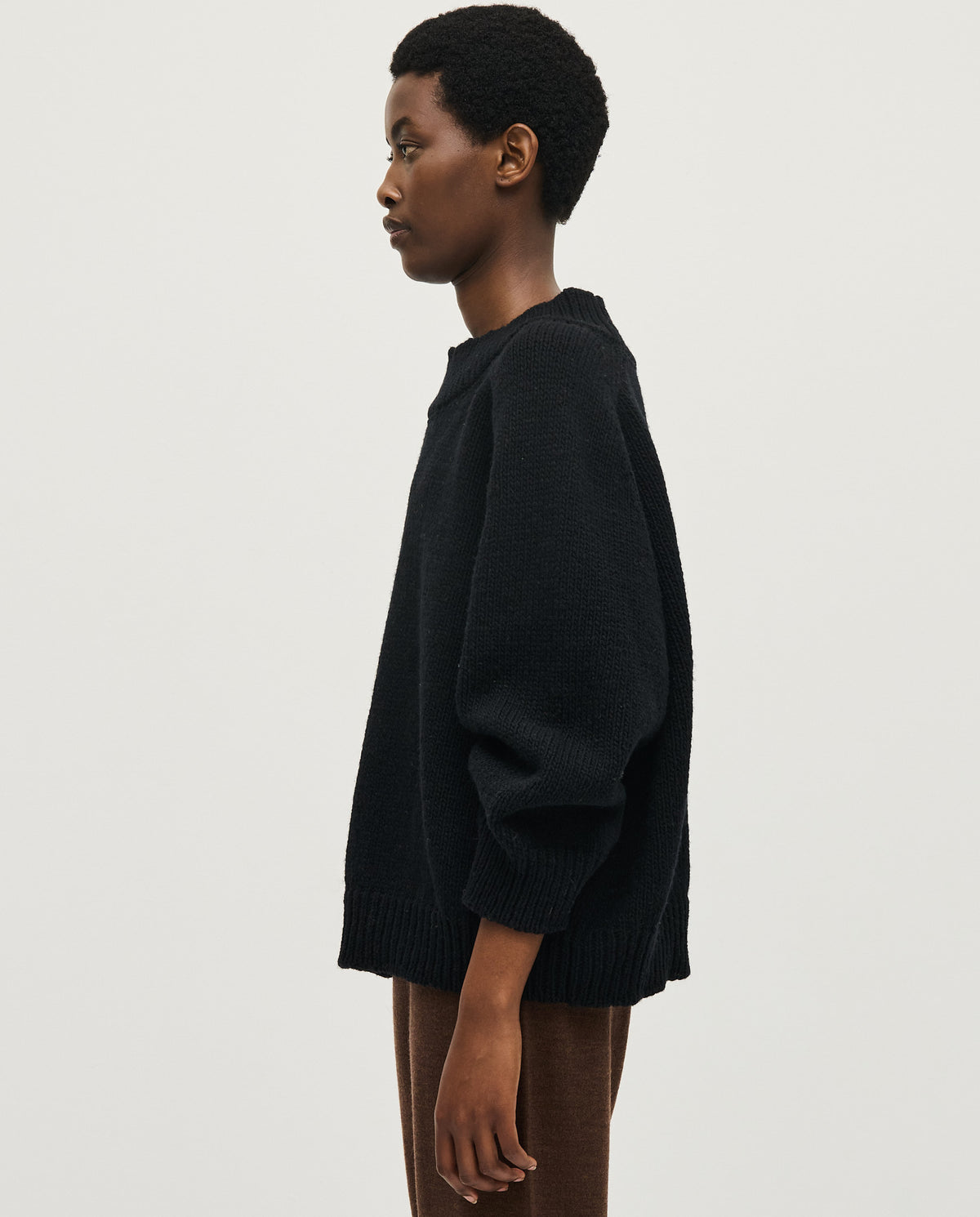 Black Babaà No51 women's jumper displayed on a model, showcasing its cozy fit and stylish design.