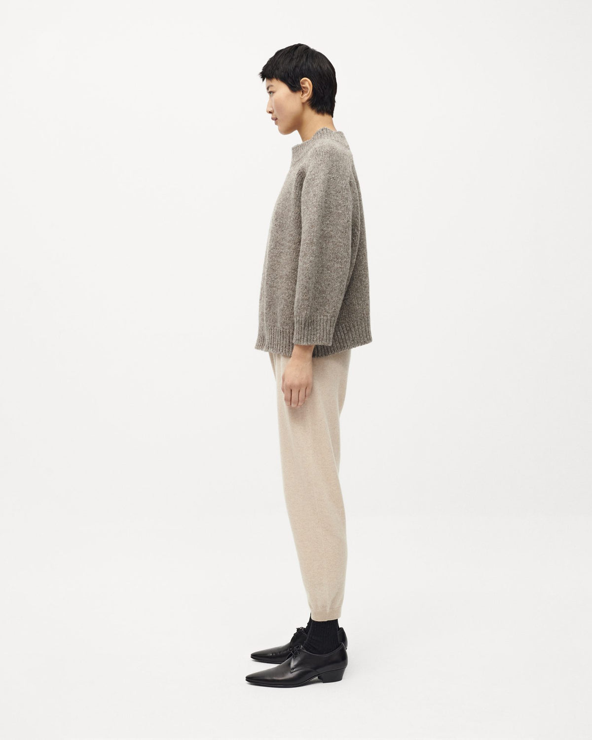 Woman wearing Babaà No51 Jumper in Dark Mist, showing the cozy, stylish knit sweater with a relaxed fit.