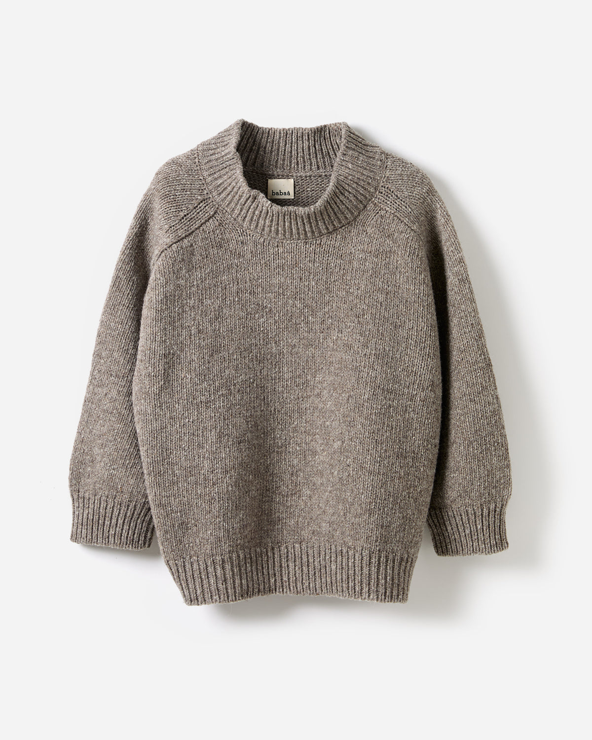 Silhouette of a woman wearing the Babaà No51 Dark Mist jumper, showcasing its relaxed fit and soft fabric in a stylish profile.